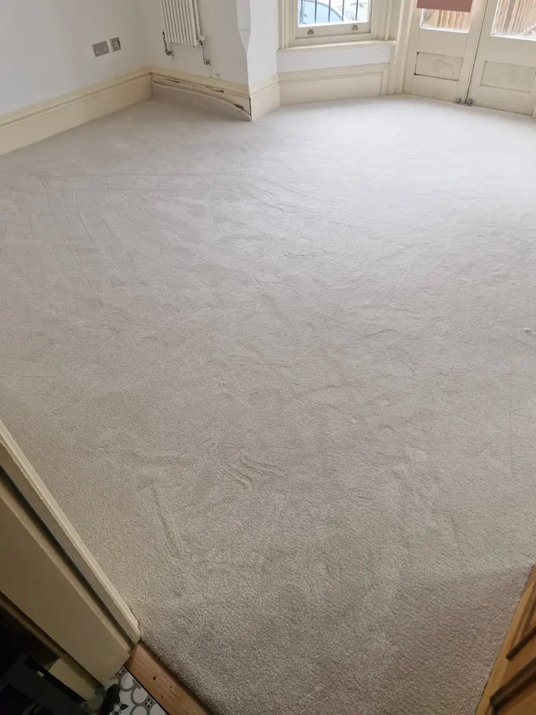 Second view of pale carpet fitted around the bay-window floor